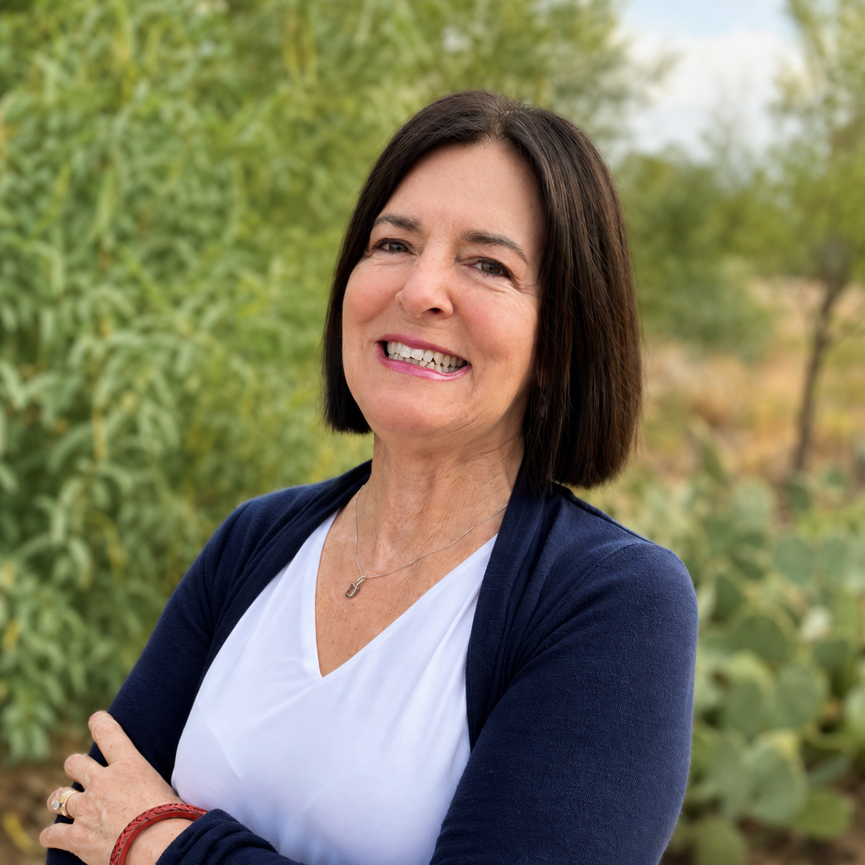 Kena, Registered Nurse and Licensed Massage Therapist, smiling outdoors